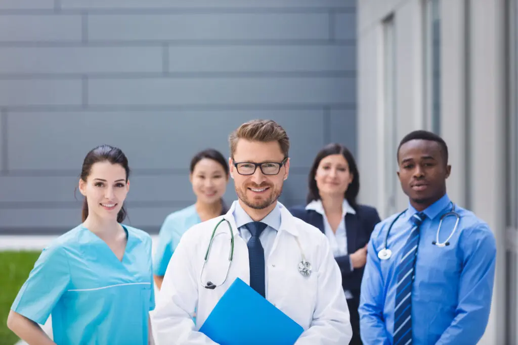 team doctors standing together hospital premises