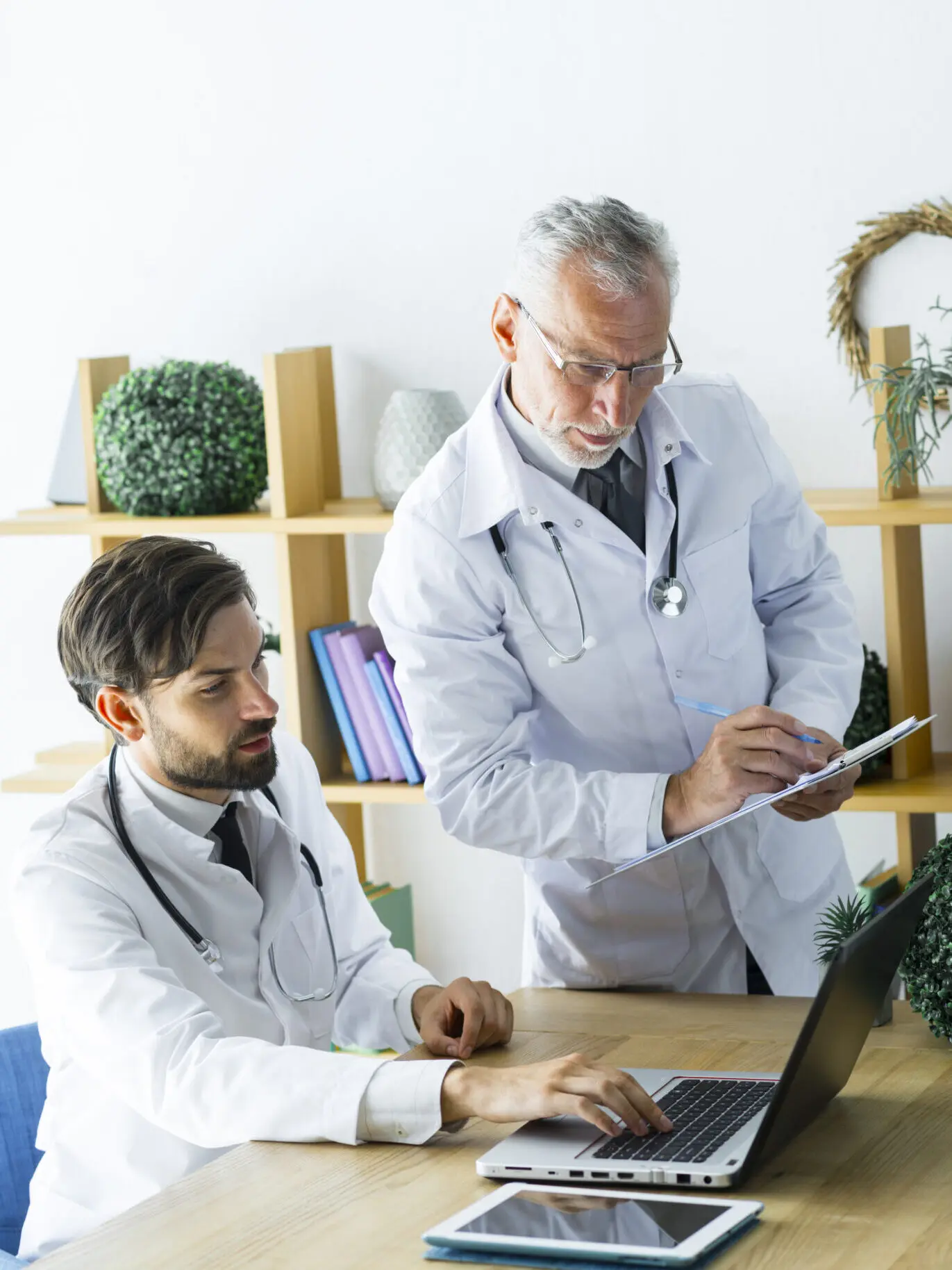 young doctor showing data senior colleague edited
